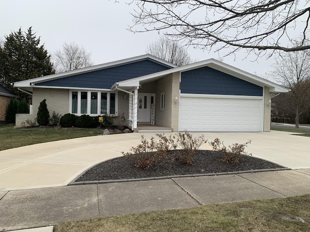 single story home with a garage and a front lawn