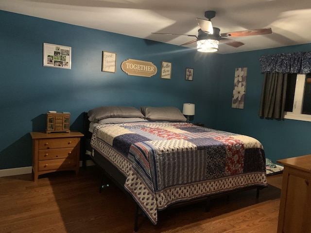 bedroom featuring hardwood / wood-style floors and ceiling fan