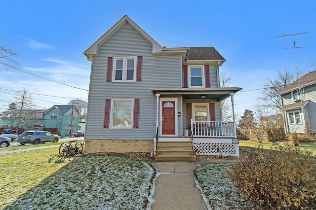 view of front facade featuring a front yard and a porch