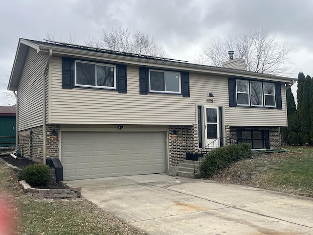 split foyer home featuring a garage