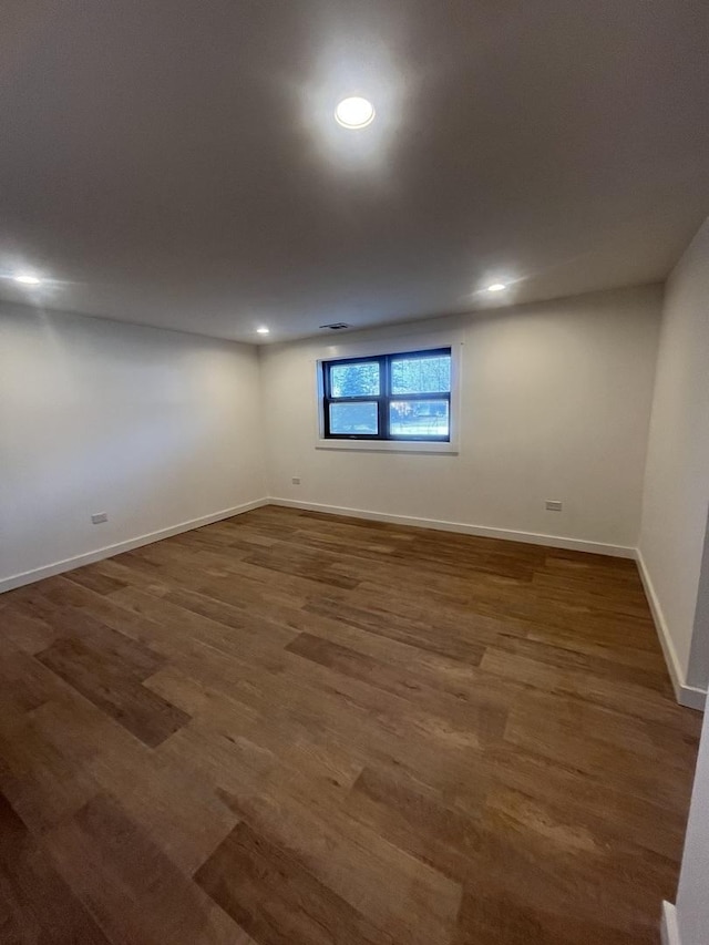 basement with dark wood-type flooring