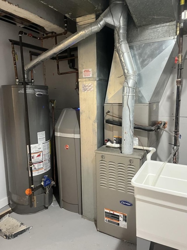 utilities featuring sink and gas water heater