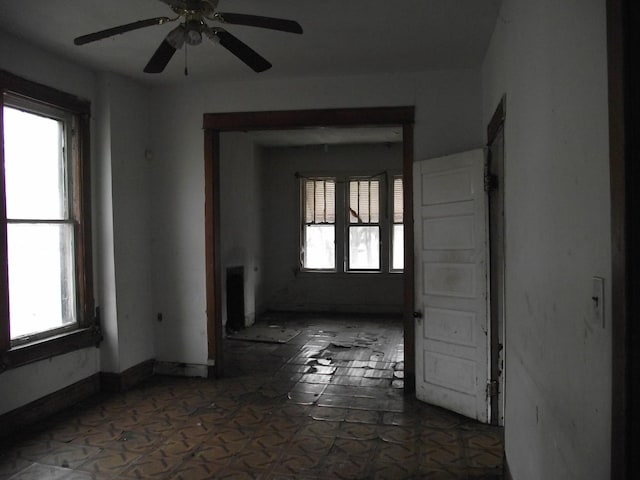 unfurnished room featuring ceiling fan