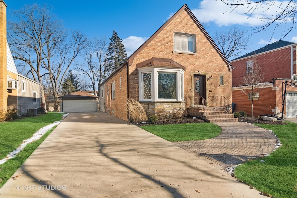 view of front of property with a garage, central AC, a front lawn, and an outdoor structure