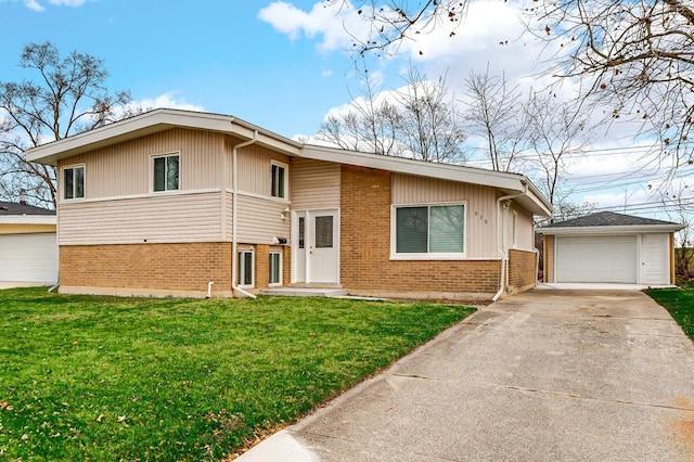 view of front of house featuring an outbuilding, a garage, and a front lawn