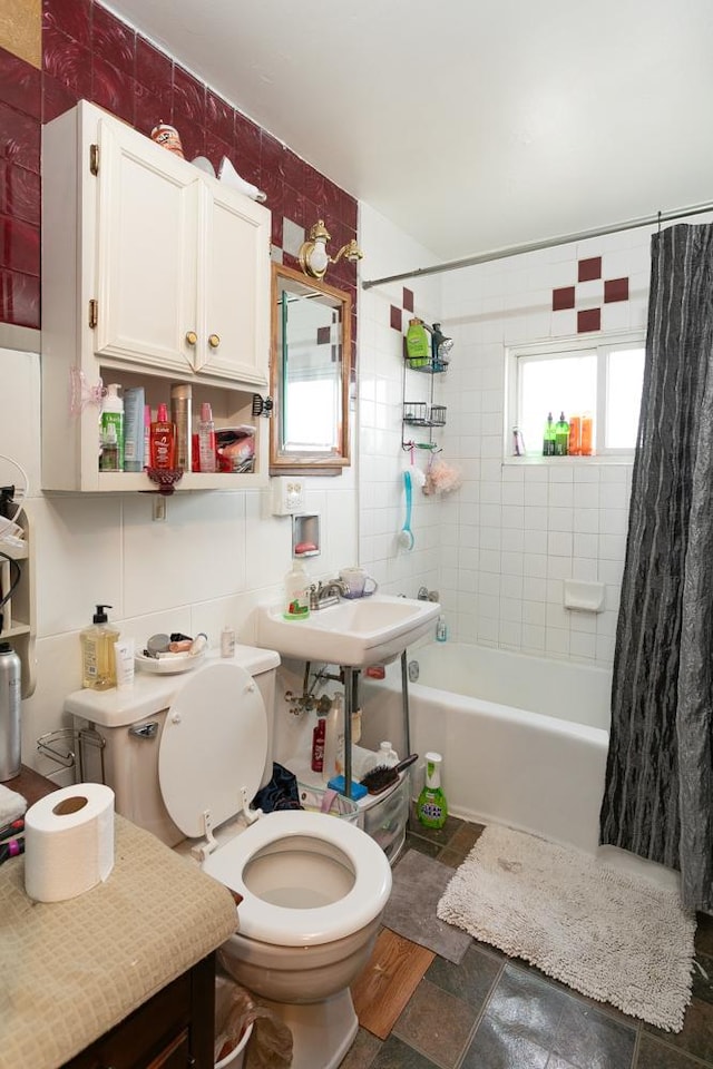 bathroom featuring decorative backsplash, tile walls, shower / tub combo, and toilet