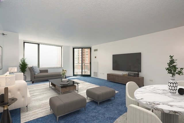 living room with carpet floors and a textured ceiling