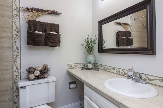 bathroom featuring vanity and toilet