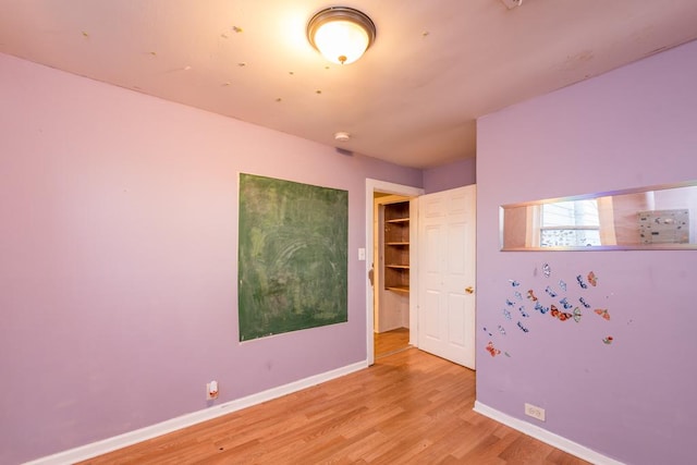 unfurnished room featuring light hardwood / wood-style flooring