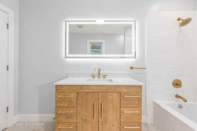 bathroom with vanity and shower / washtub combination