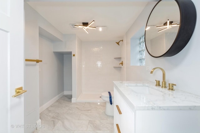 bathroom with toilet, a shower, and vanity