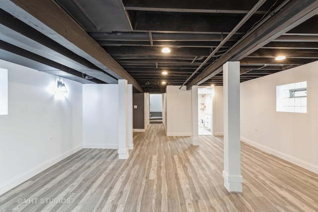 basement featuring light hardwood / wood-style flooring