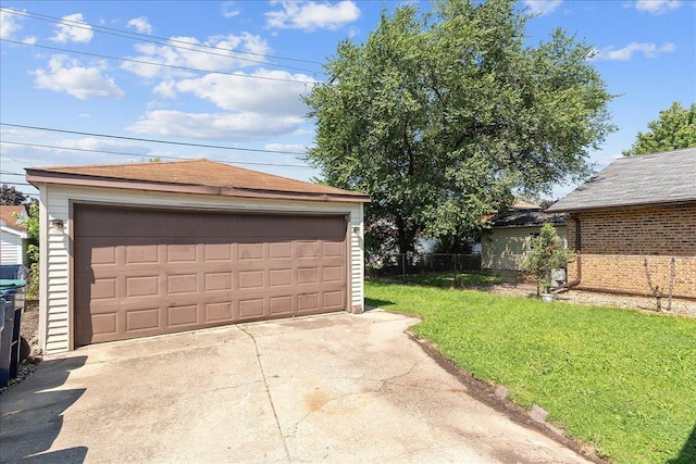 garage featuring a lawn