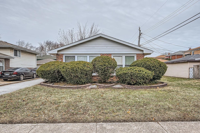 view of home's exterior with a lawn