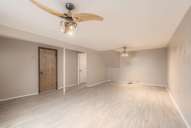 bonus room with ceiling fan and hardwood / wood-style floors