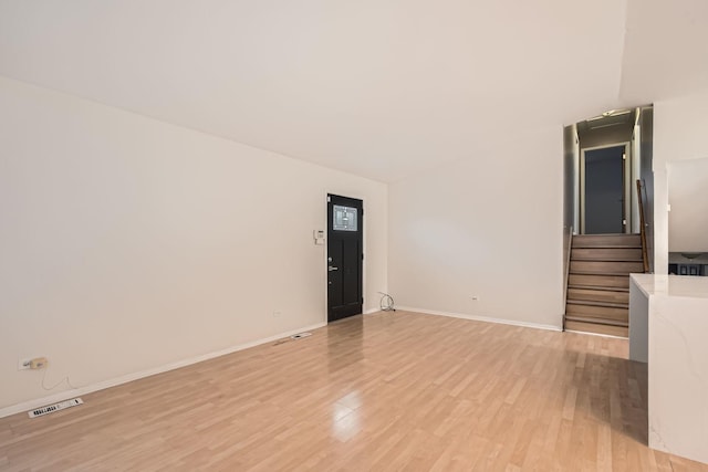 unfurnished living room featuring light hardwood / wood-style flooring