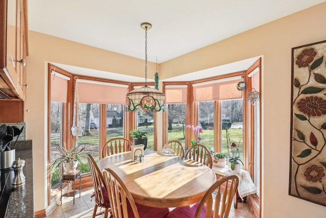 dining area featuring light tile patterned floors