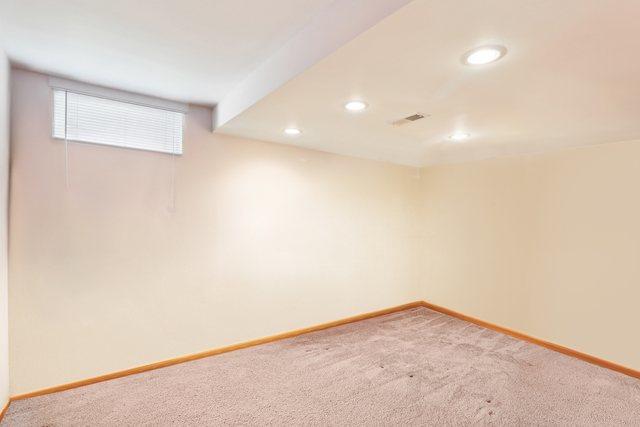 basement featuring carpet flooring