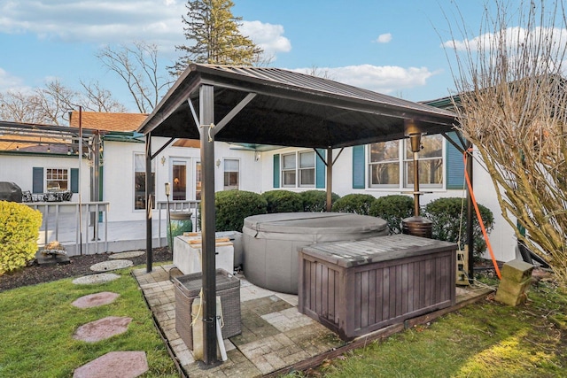 view of patio featuring a gazebo and a hot tub