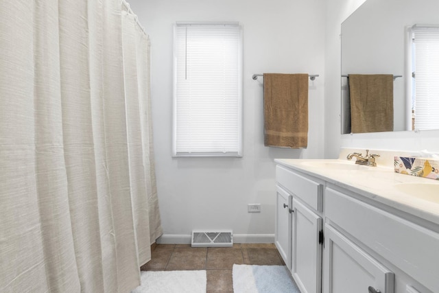 bathroom with vanity and tile patterned floors