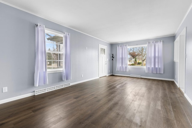 empty room with ornamental molding and dark wood-type flooring