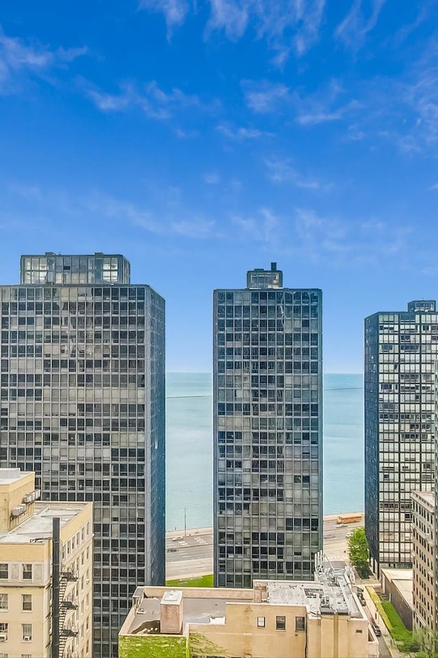 city view featuring a view of the beach and a water view