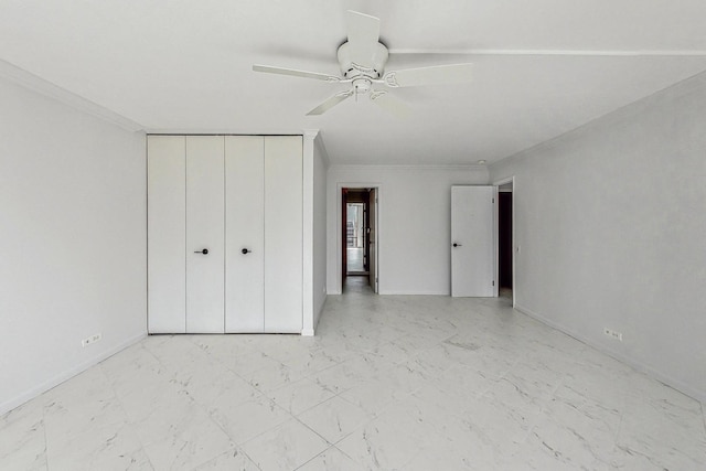 unfurnished bedroom featuring ceiling fan, crown molding, and a closet