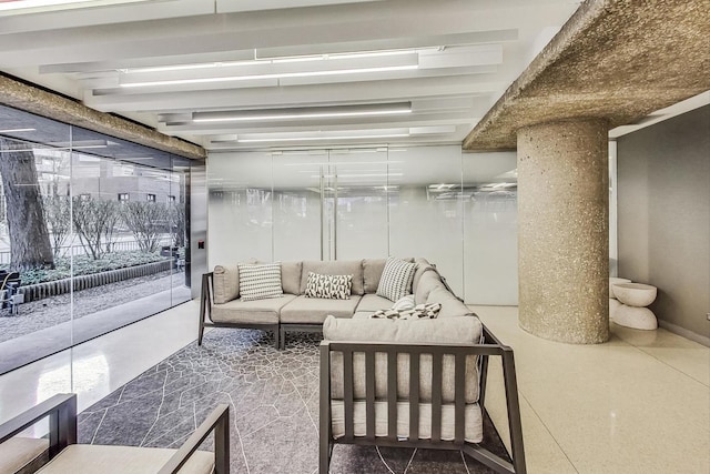 living room with beam ceiling