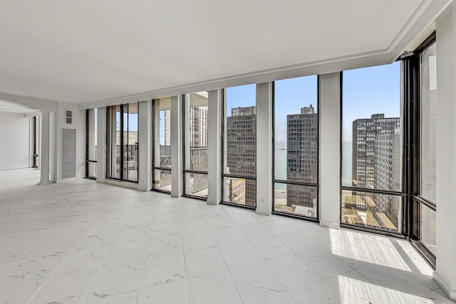 empty room featuring floor to ceiling windows