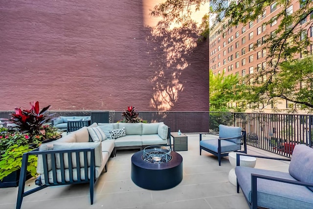 view of patio featuring an outdoor living space with a fire pit