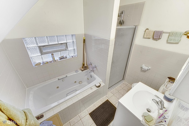 bathroom featuring tile patterned floors, sink, and shower with separate bathtub