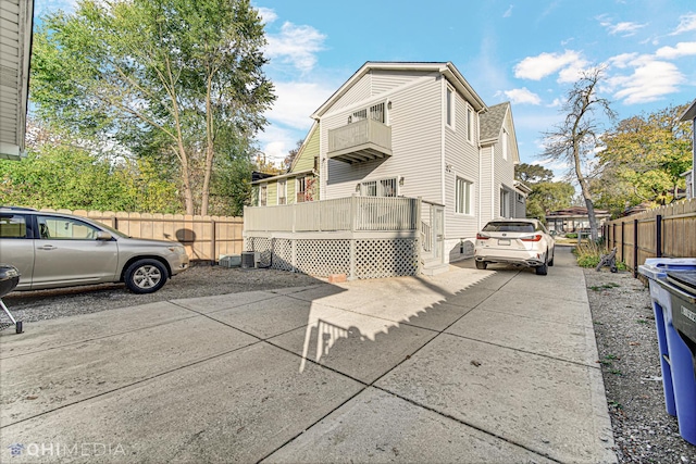 view of side of home featuring a deck