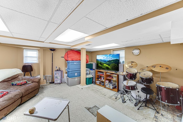 living room featuring a drop ceiling