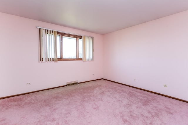 spare room featuring carpet floors