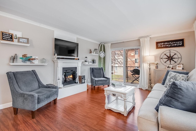 living room with wood-type flooring and crown molding