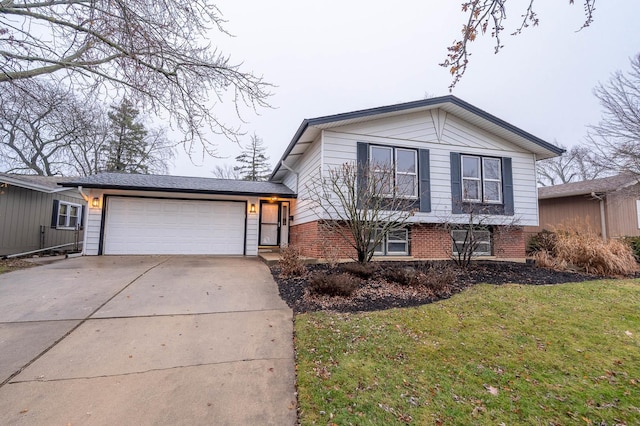 tri-level home featuring a front lawn and a garage