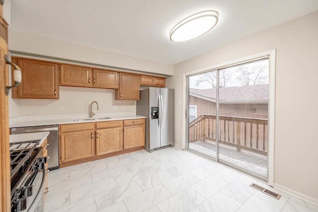 kitchen with sink and stainless steel appliances