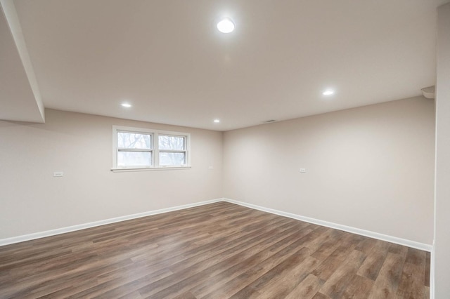 spare room featuring dark hardwood / wood-style floors