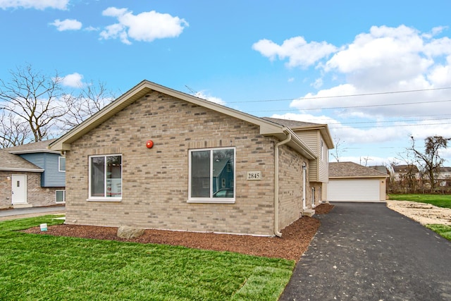 view of property exterior with a garage and a yard