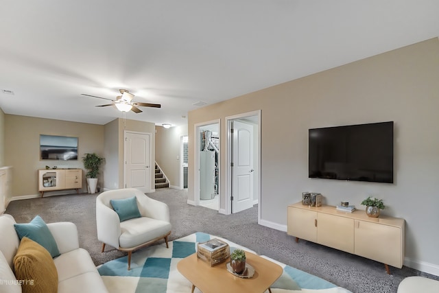 carpeted living room featuring ceiling fan