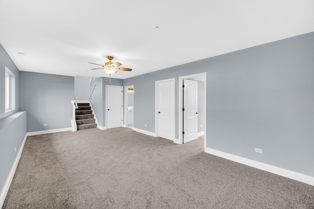 unfurnished living room with carpet flooring and ceiling fan