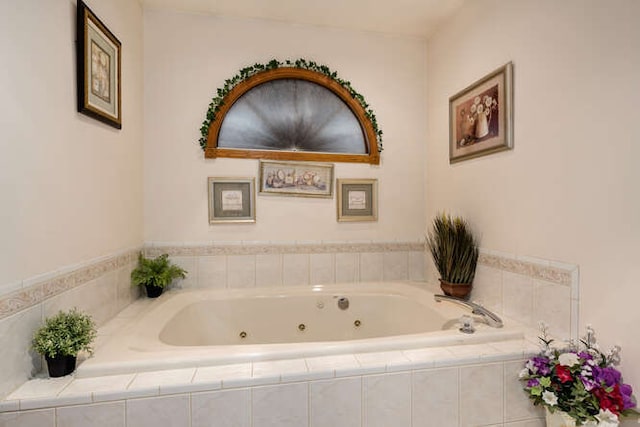 bathroom with tiled tub