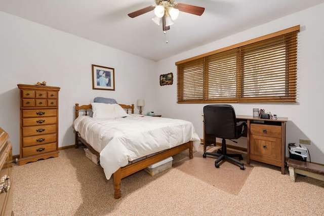 bedroom featuring light colored carpet and ceiling fan