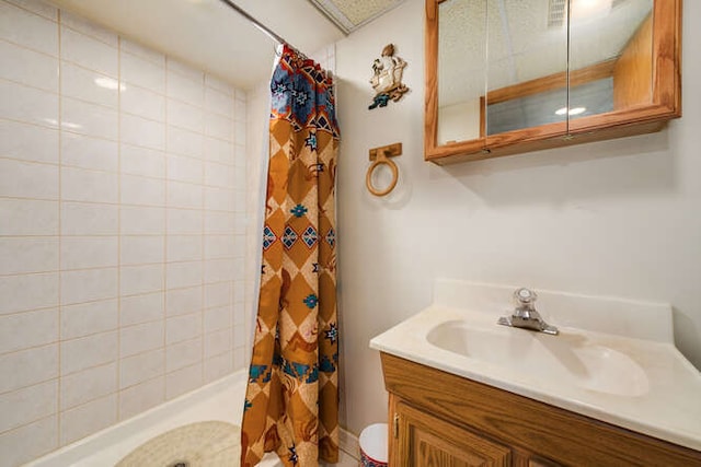 bathroom featuring vanity and walk in shower