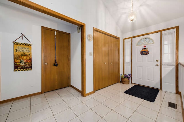 foyer entrance featuring light tile patterned floors