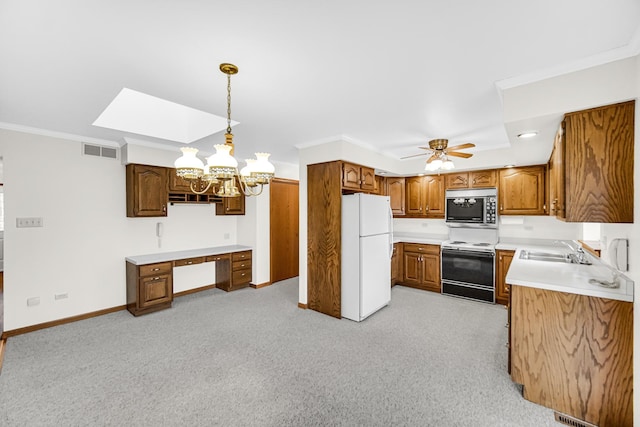 kitchen featuring light colored carpet, ceiling fan with notable chandelier, decorative light fixtures, and white appliances