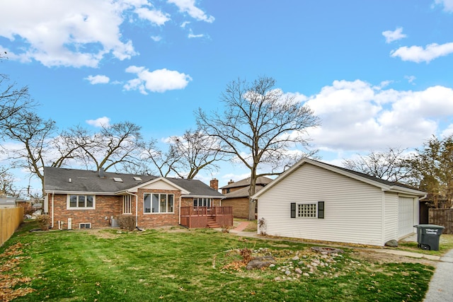 back of house with a lawn, a garage, and a wooden deck