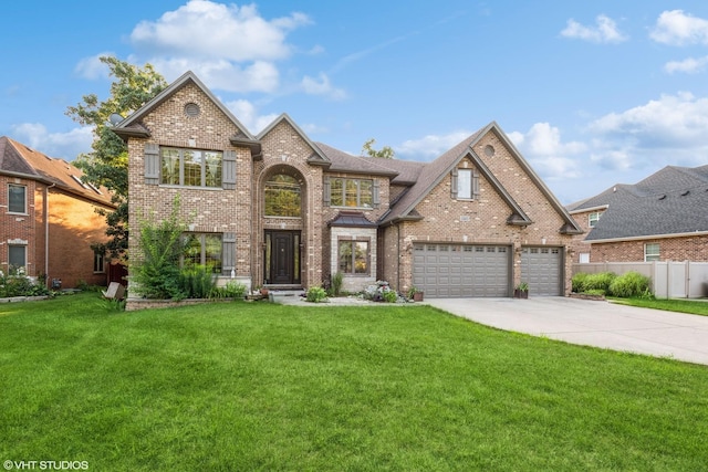 view of front of property featuring a garage and a front yard