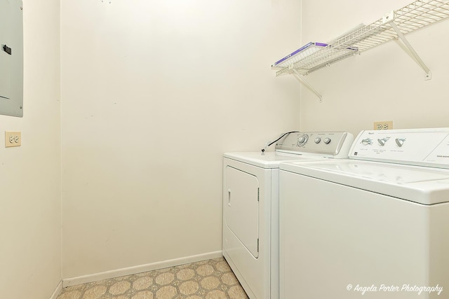 clothes washing area with electric panel and washer and dryer