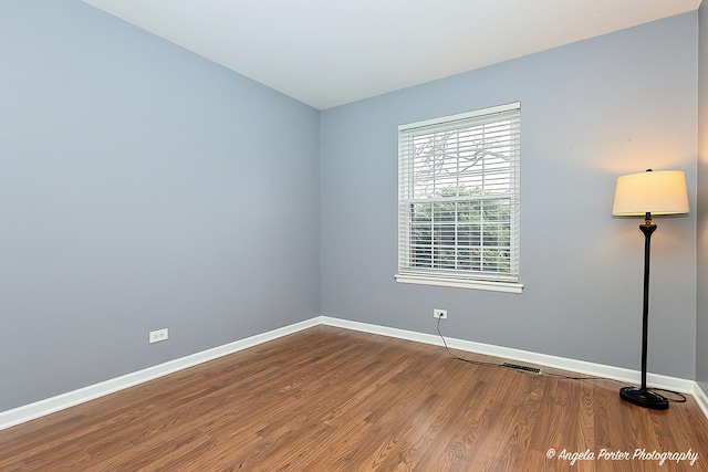 spare room featuring hardwood / wood-style floors